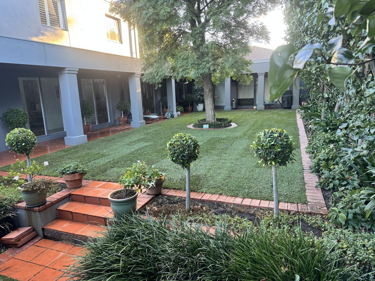 A beautifully manicured courtyard lawn